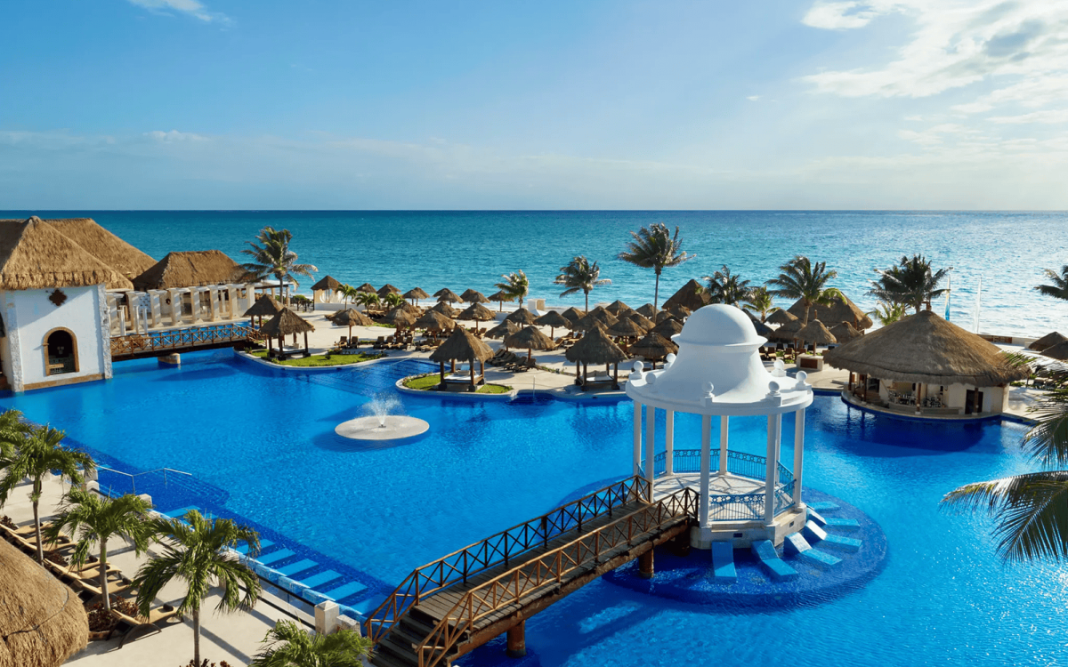 Beachfront pools and tropical grounds at Luxury Sapphire Riviera Cancún