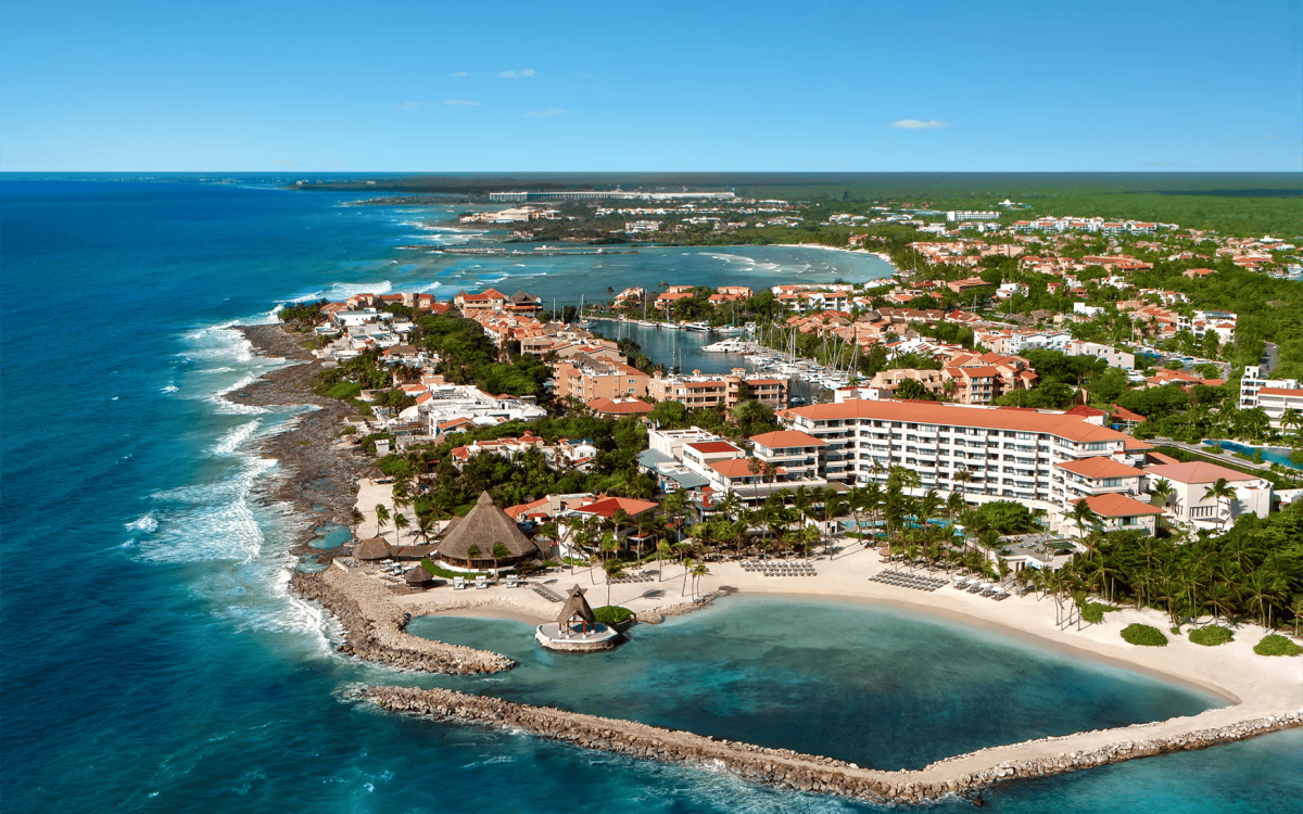 Oceanfront pools and tropical grounds at Luxury Aventuras Resort & Spa in Puerto Aventuras