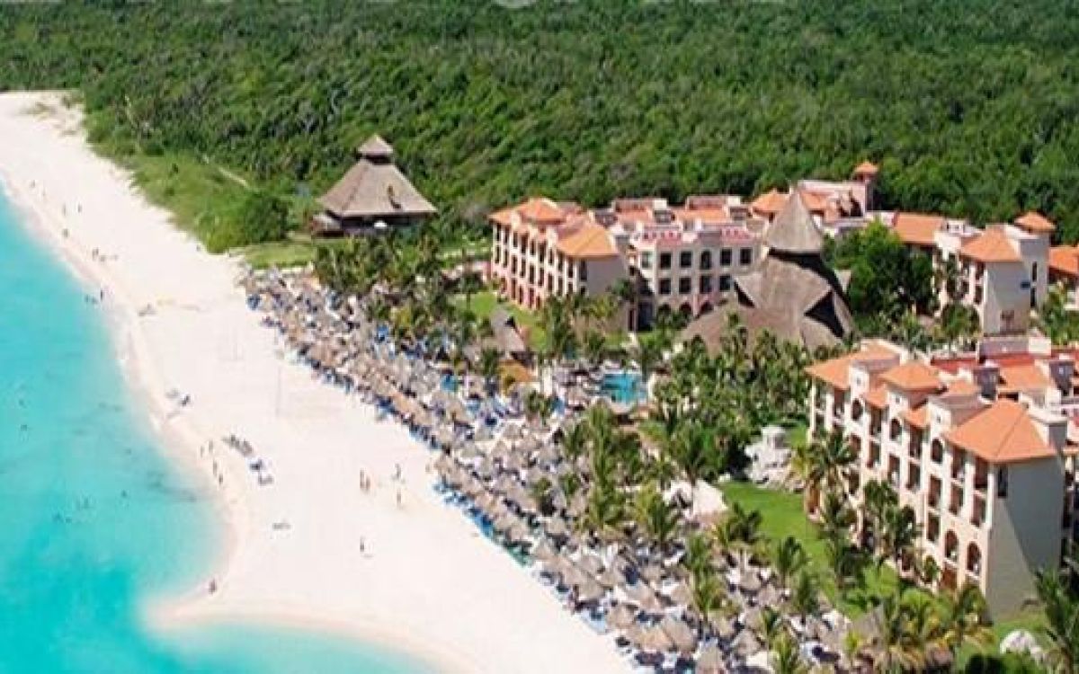 Beachfront pools and tropical grounds at Sandos Playacar Beach Resort and Spa
