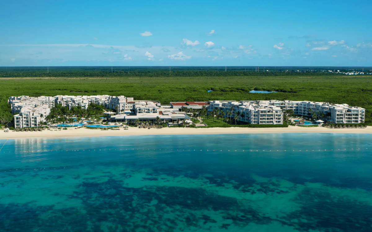Beachfront pools and tropical grounds at Luxury Jade Riviera Cancún
